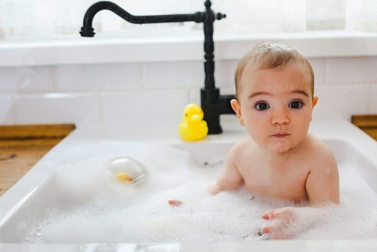 bathing newborn in sink