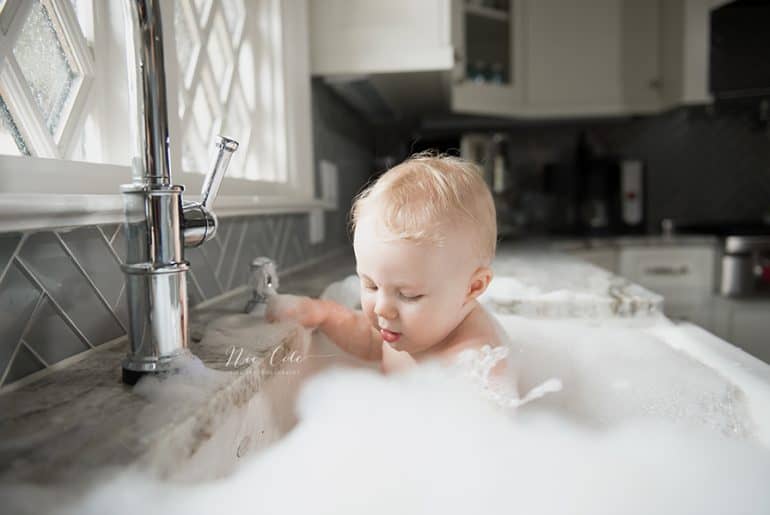 bathing newborn in sink