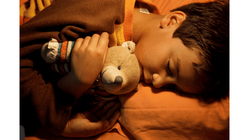 Child-sleeping-with-teddy-bear