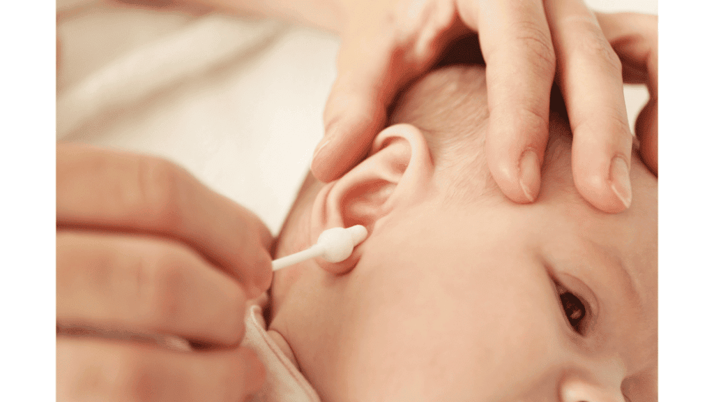 Cleaning baby's ears with cotton swabs