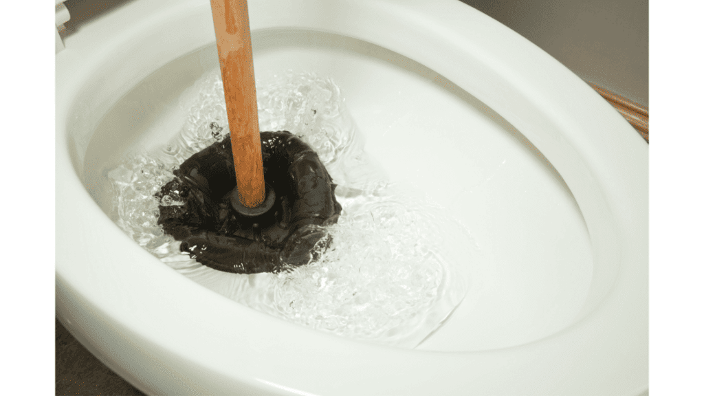 unclogging toilet with plunger