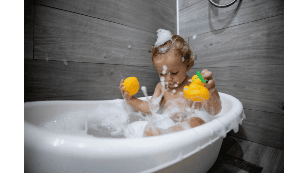 baby bathing in bathtub