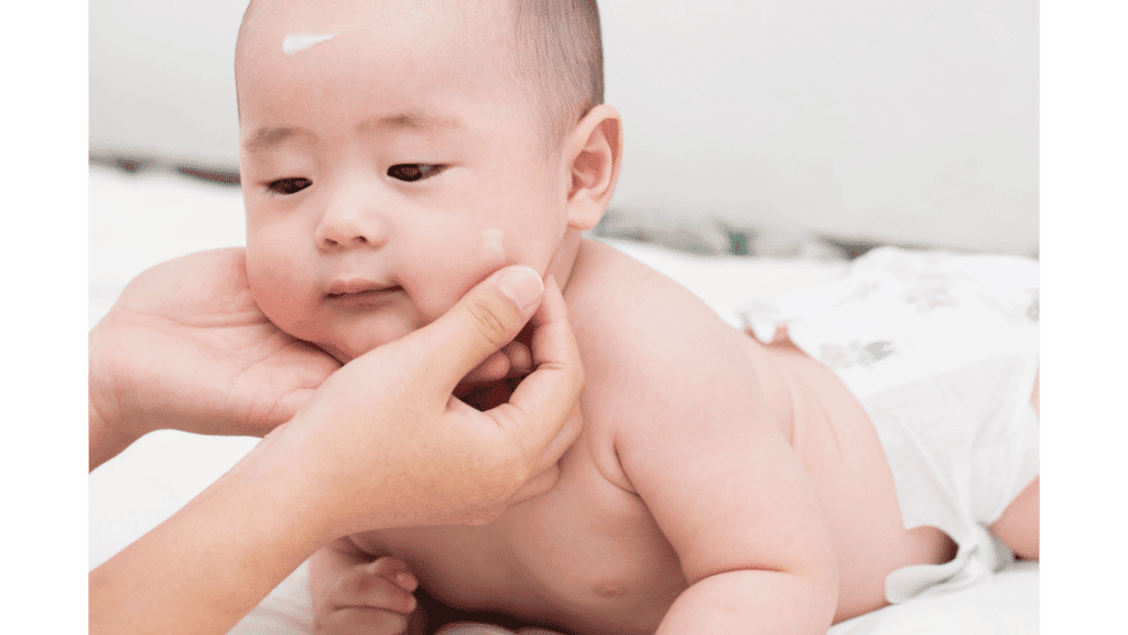 Putting lotion on baby's skin